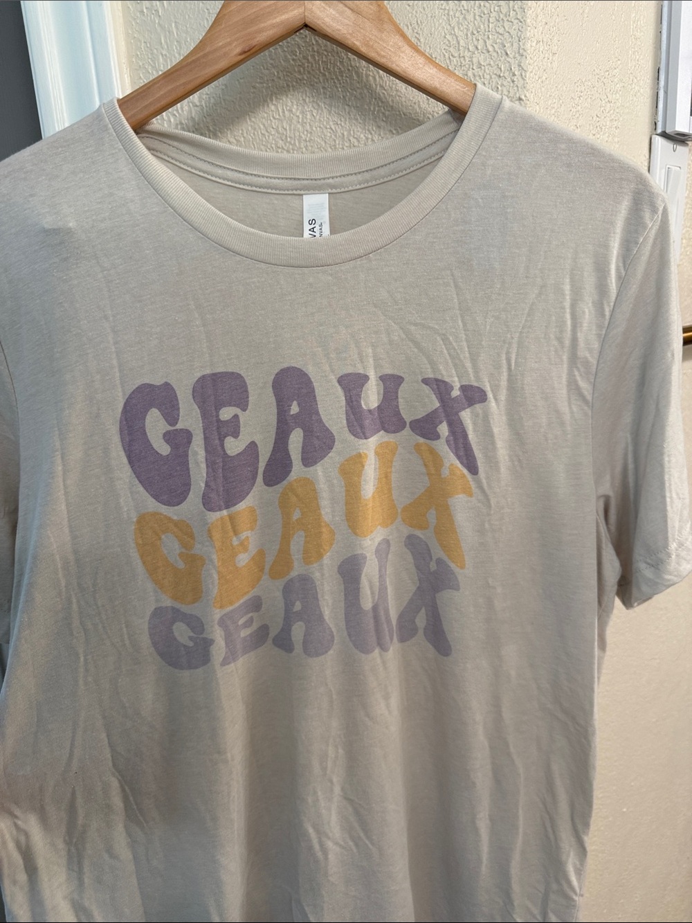 Bella Canvas Light Beige Short Sleeve Tee with Purple & Mustard Geaux Print